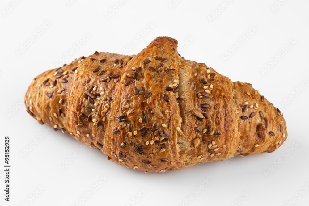French wheat croissant with seeds isolated French wheat croissant with seeds isolated
