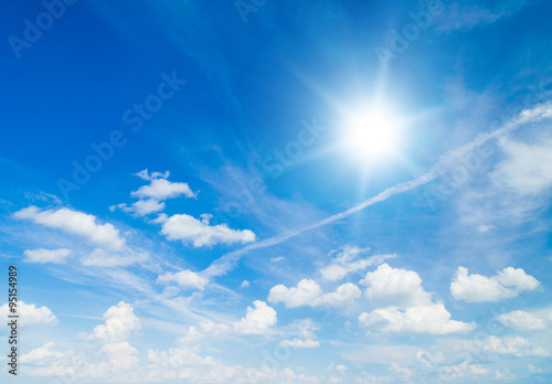The blue sky with clouds, background