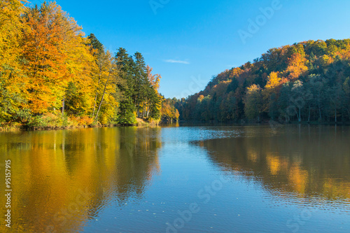 Reflection of trees on Trakoscan lake in Zagorje, Croatia, season, autumn