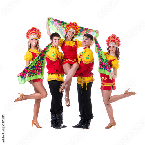 Dancer team wearing a folk costumes isolated on white