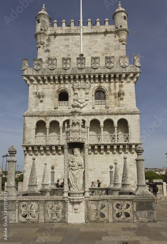 Architectural close up of Belem tower frontal facade in Lisbon from its terrace, with few people around