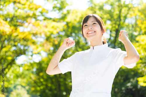 young asian nurse in the park photo