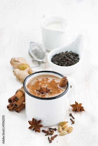 Fototapeta Naklejka Na Ścianę i Meble -  Masala tea and ingredients, vertical