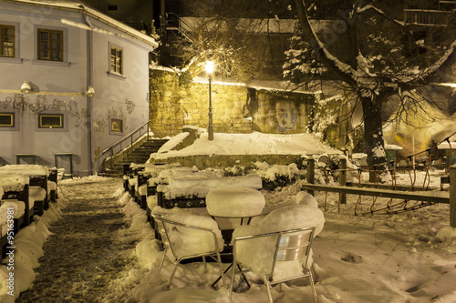 night view of pavement cafe covered with snow. Zagreb. Croatia. © phant