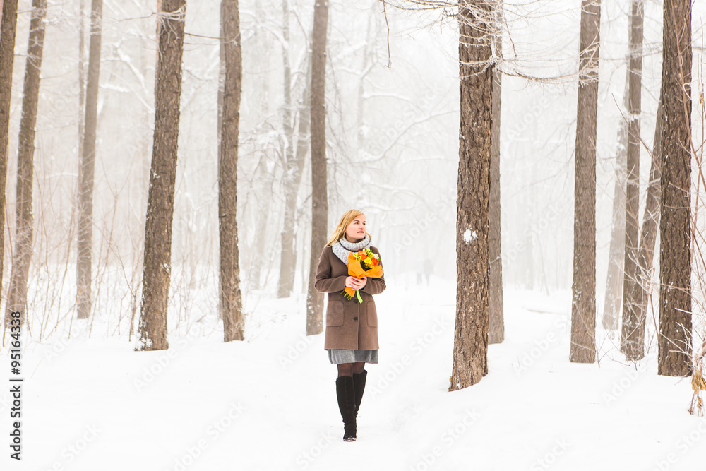 young woman in winter forest