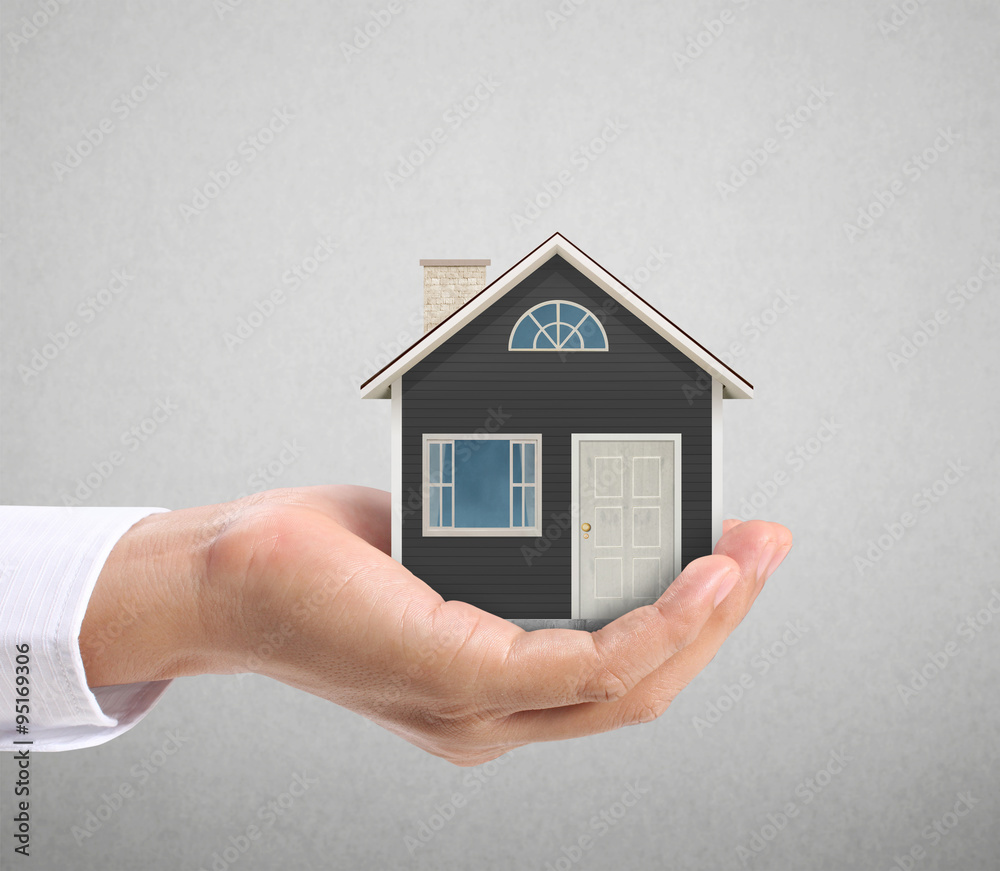 holding house representing home ownership holding house representing home ownership