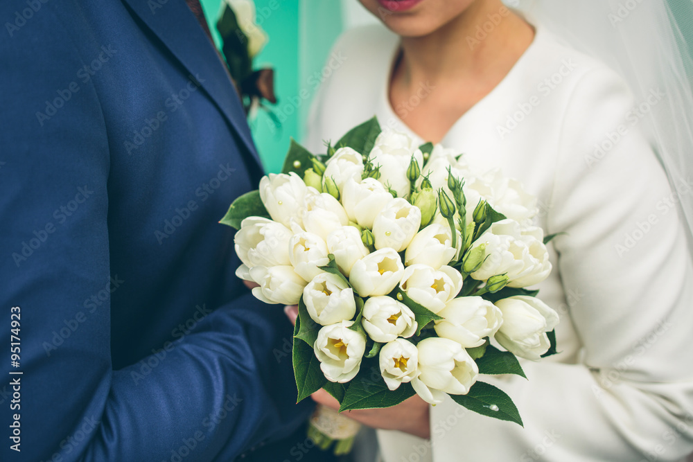 groom and bride holding beautiful white tulip bouquet groom and bride holding beautiful white tulip bouquet
