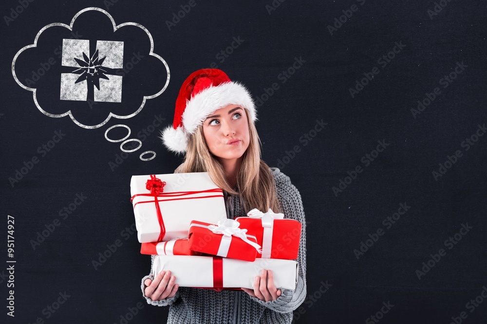 Composite image of festive blonde holding pile of gifts Composite image of festive blonde holding pile of gifts