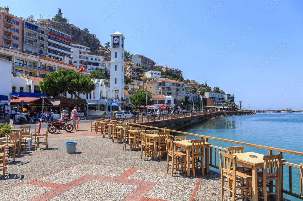 Kusadasi on the Aegean Sea in Turkey - promenade and waterfront. Kusadasi is a major tourist center with modern yacht port - obrazy, fototapety, plakaty 