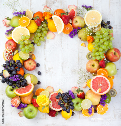 Fruits  berries   flowers frame  white wooden background. Copy space.