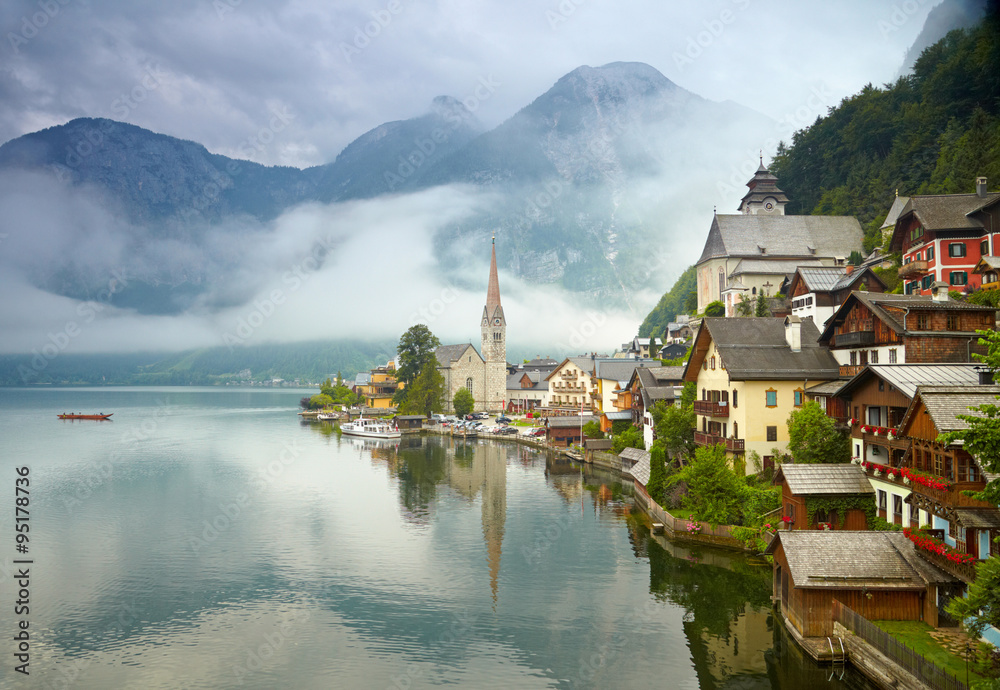 Fototapeta premium Hallstatt mountain village. Foggy morning