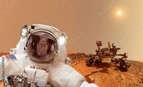Billede på lærred Astronaut with rover in background - Elements of this image furnished by NASA