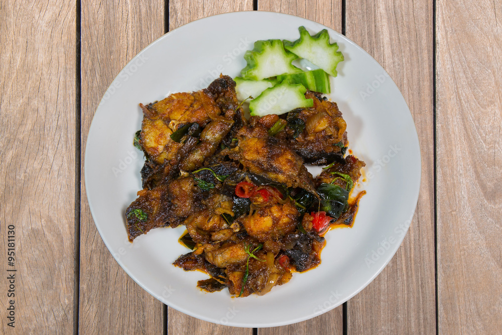 phad pla duk krob (stir fried deep fried catfish with curry past
