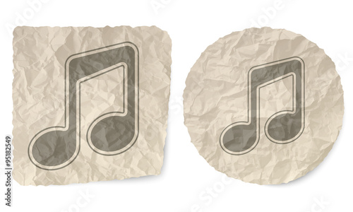 Crumpled slip of paper and a music symbol
