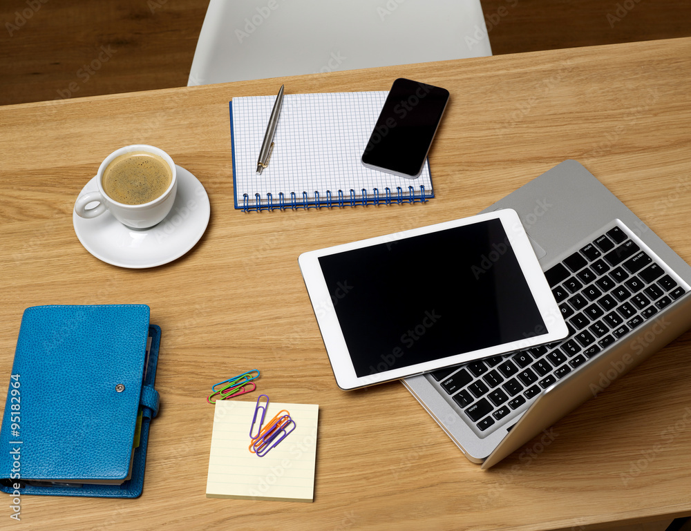 Office desk with portable devices Office desk with portable devices