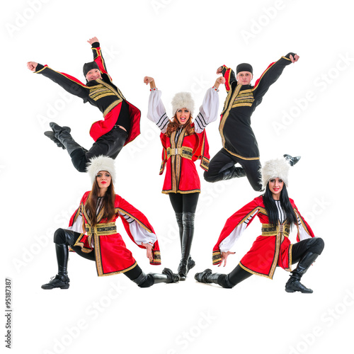 dancer team wearing a folk Caucasian highlander costumes jumping