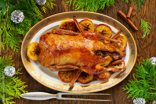 Festive Christmas duck baked with apples and figs.