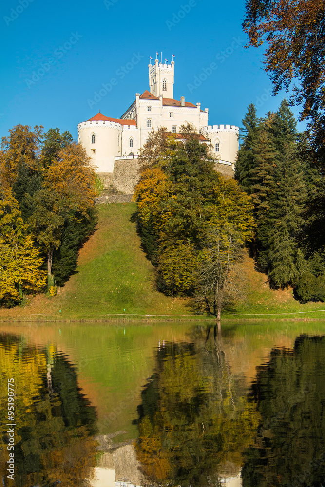 Castle of Trakoscan on the hill in autumn, Zagorje, Croatia, reflection on the lake