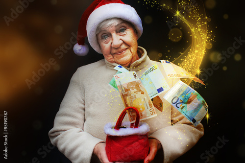 senior woman with Christmas money gift....