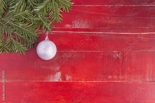 Christmas background.

Christmas fir tree branches on a red background.
