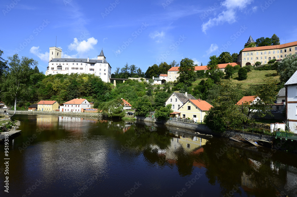 Rozmberk nad Vltavou, Czechia, castle Rozmberk and homes reflecting in river Mltava (Moldau)