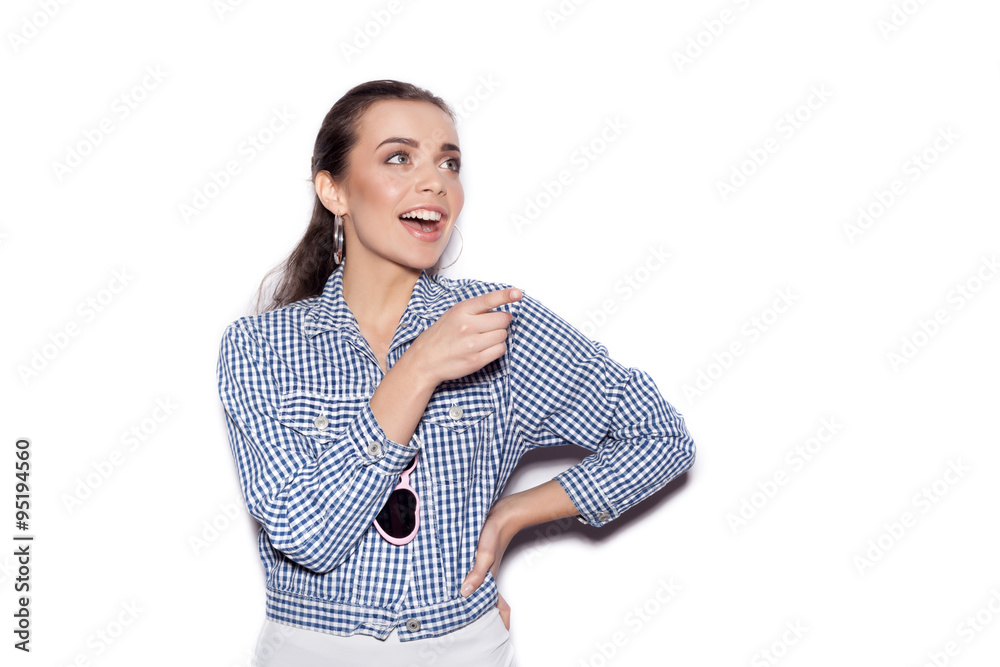 Happy smiling girl in a blue plaid shirt on white background Happy smiling girl in a blue plaid shirt on white background