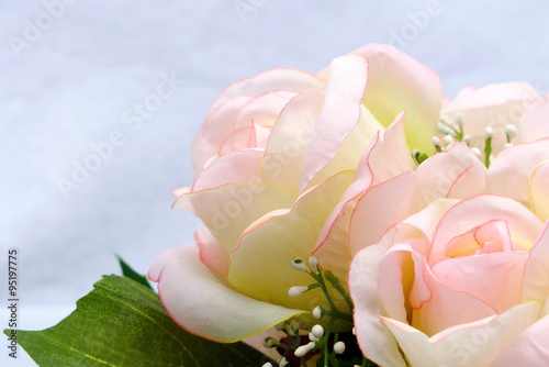 Fototapeta Naklejka Na Ścianę i Meble -  Pink artificia flower on white cloth background