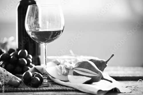Still life with various types of Italian food and wine,  black and white retro stylization