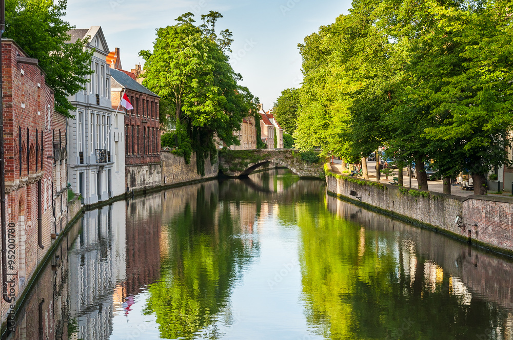 Bridge over canal with traditional europe architecture Bruges Be