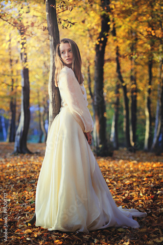 Beautiful woman posing in birch woods