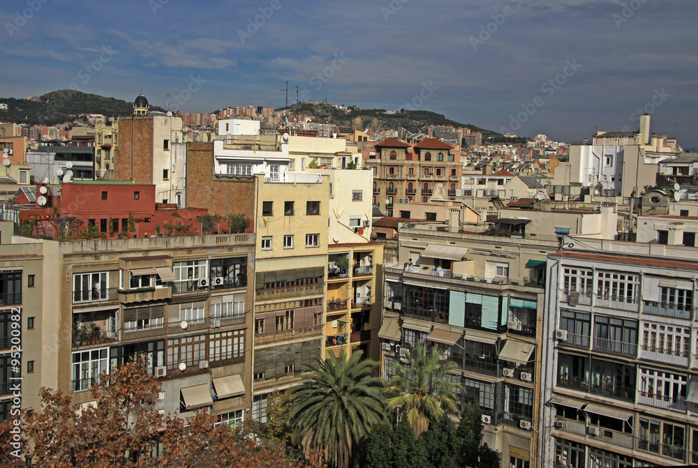 BARCELONA, CATALONIA, SPAIN - DECEMBER 13, 2011: Multi-storey buildings and roofs in Barcelona