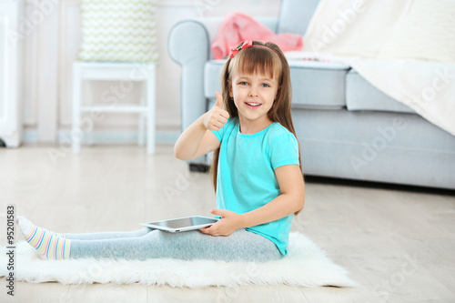 Little cute girl with digit...