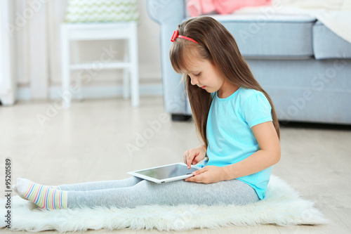 Little cute girl with digit...