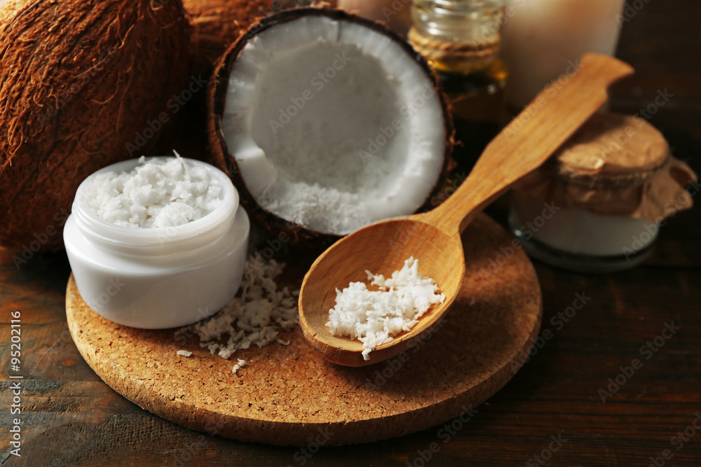 Spa coconut products on dark wooden background Spa coconut products on dark wooden background