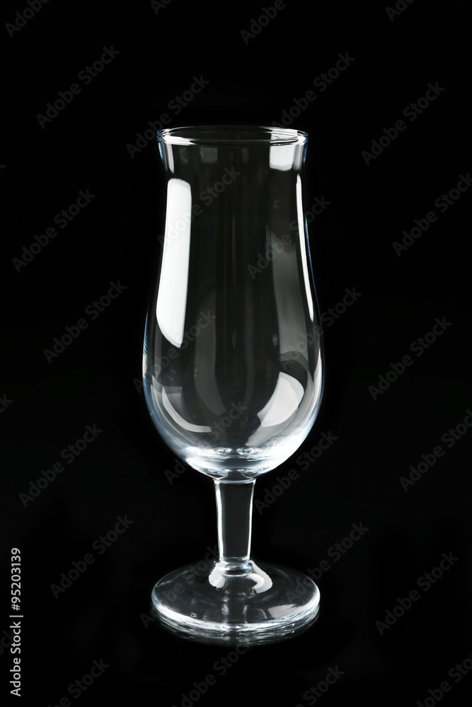 Empty cocktail glass on black background Empty cocktail glass on black background
