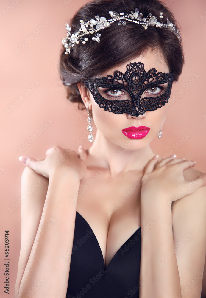 Elegant hairstyle. Beautiful Girl in black veil mask. Masquerade Elegant hairstyle. Beautiful Girl in black veil mask. Masquerade