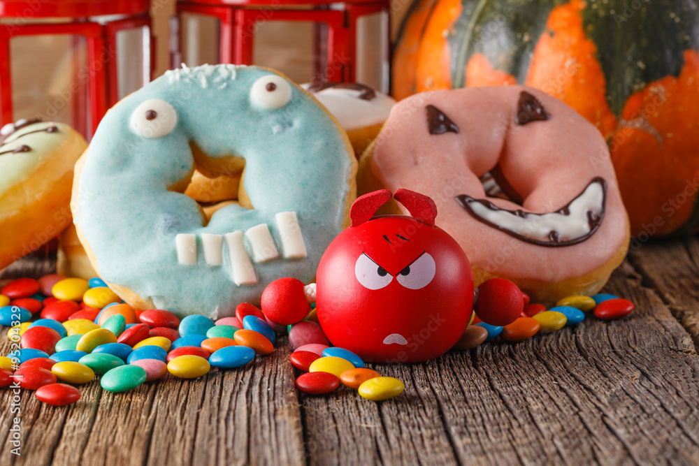 Halloween donuts on wooden table