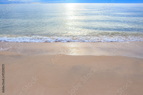 Sand beach with wave of the sea. © Phongsak