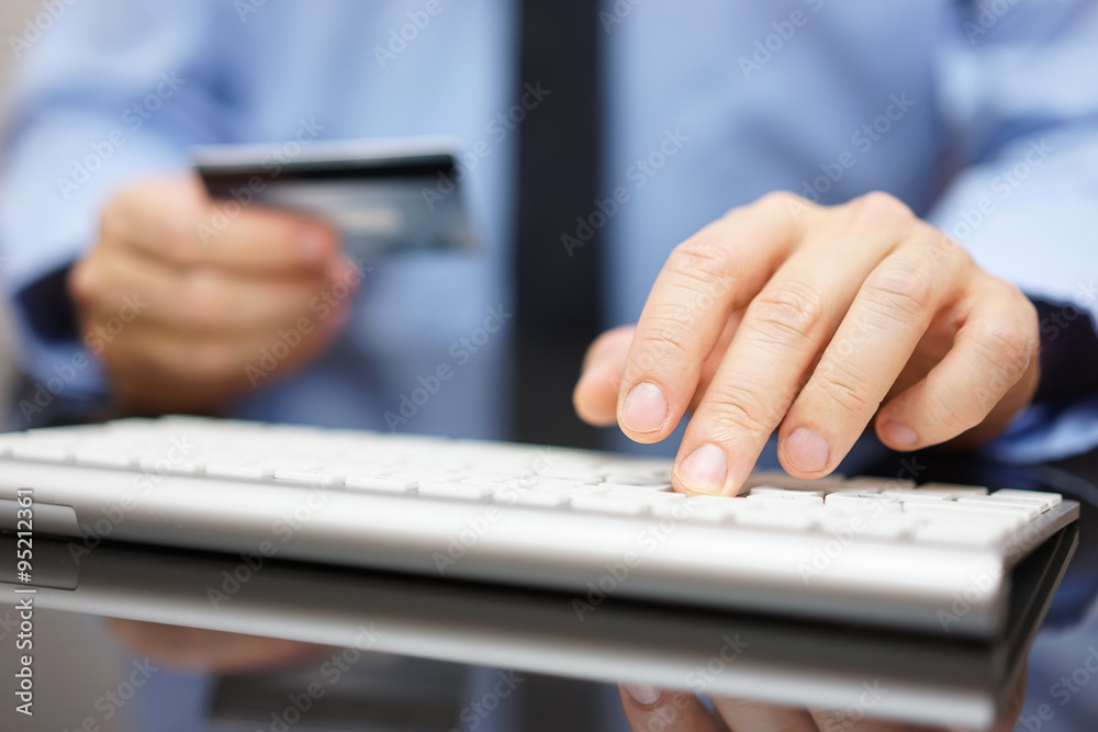 businessman in office is making bank transfer or on line purchas businessman in office is making bank transfer or on line purchas
