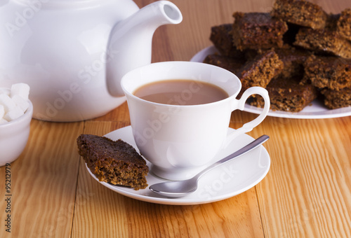 Quadro su tela Cup of English Tea with Cake for Tea Break in Afternoon