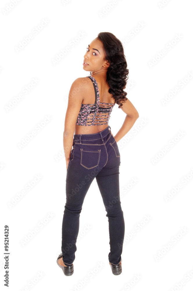 African American woman in jeans from the back. African American woman in jeans from the back.