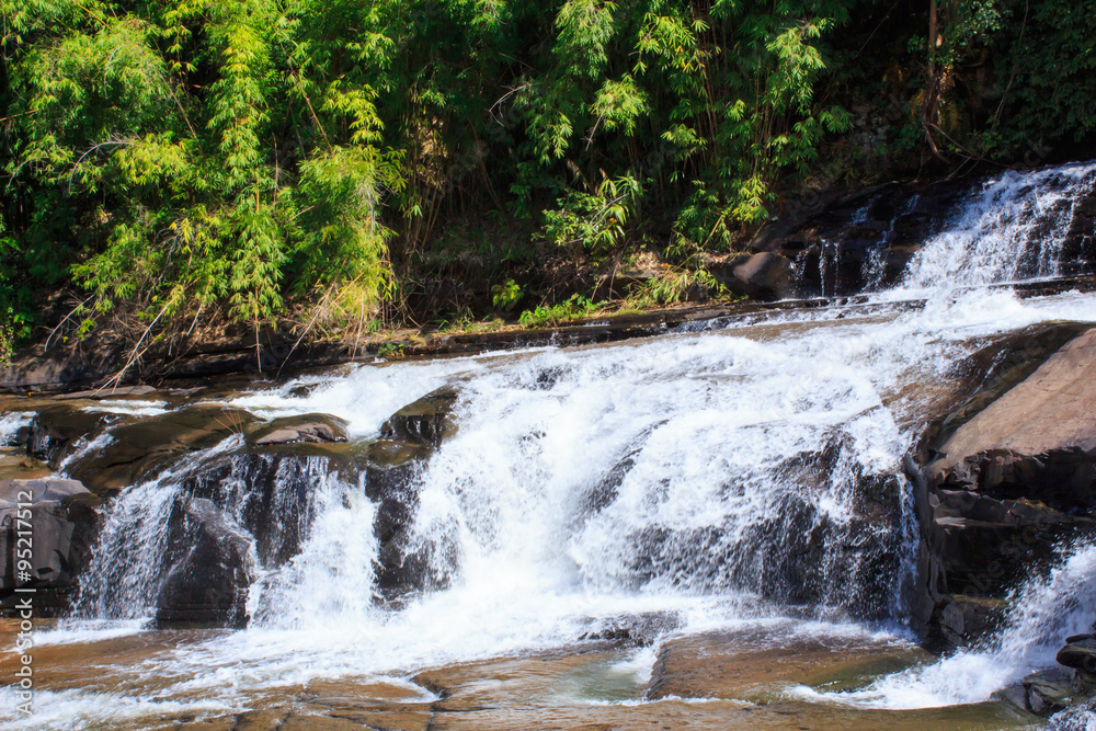 Fototapeta premium Deep forest waterfall at Thaisantisuk waterfall National Park Kh