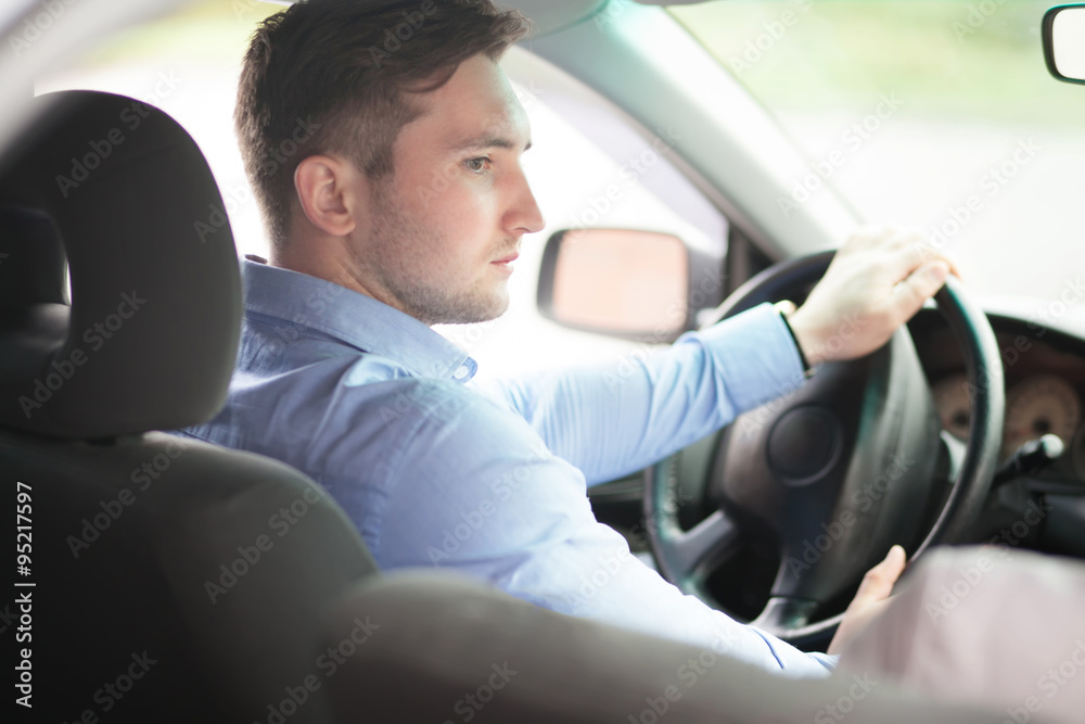 Portrait of a man driving a car Portrait of a man driving a car