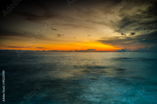 beautiful nature sunset on moody sea background: soft focus