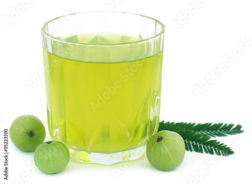 Herbal amla juice with fresh fruits photo