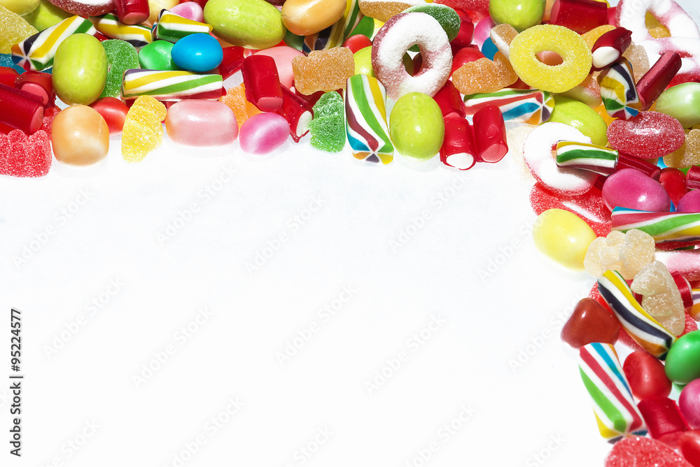 Different colored candies isolated in white background
