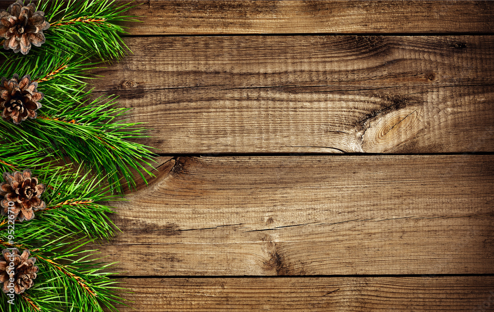 Wooden background with pine tree branches Wooden background with pine tree branches