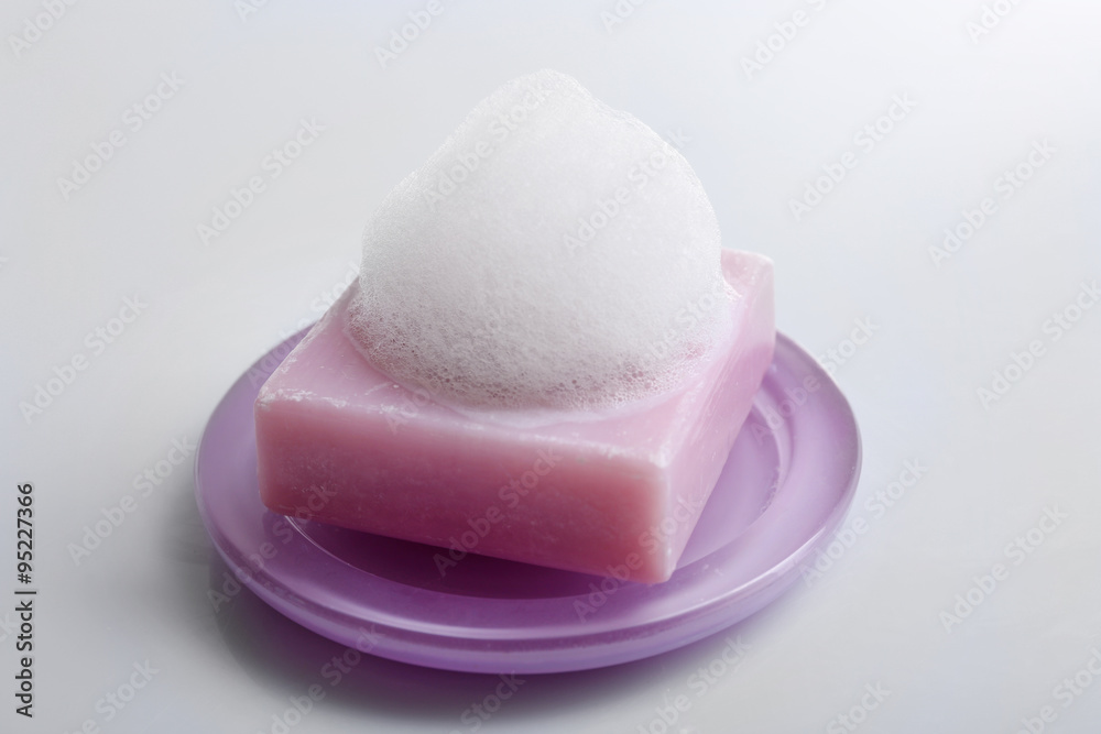 Soap with foam isolated on white