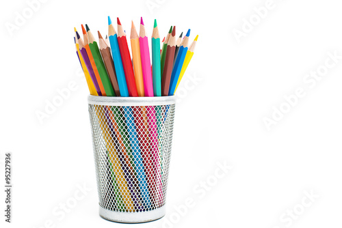 Colored pencils in a pencil case on white background Fototapet