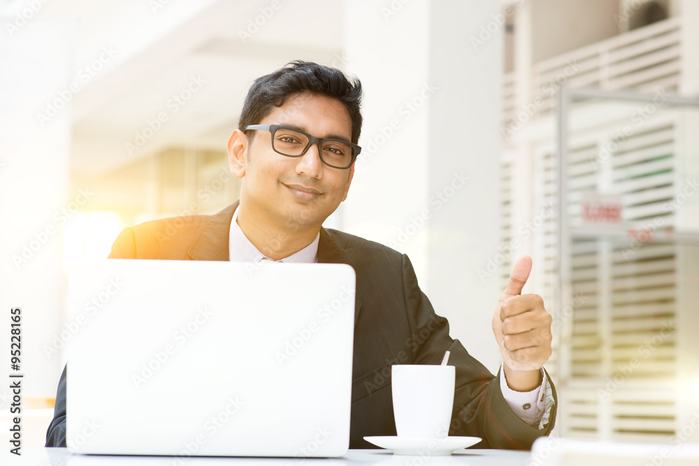 Business man using laptop computer at cafe thumb up Business man using laptop computer at cafe thumb up